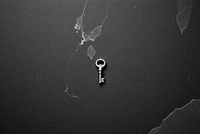 A key on dark stone